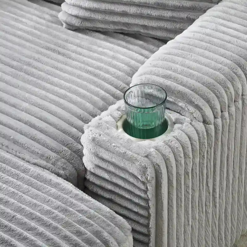 Canapé confortable en velours côtelé avec plusieurs coussins et options de rangement